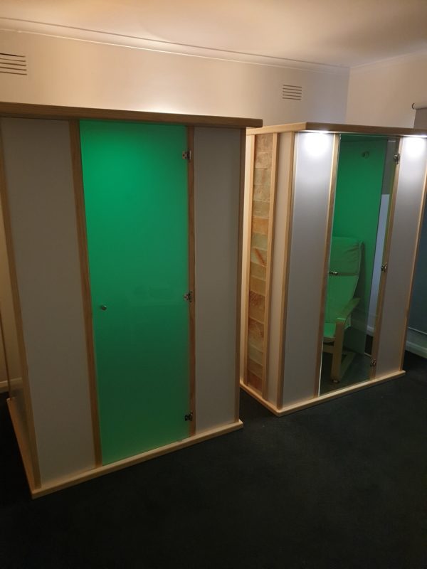 Salt Booths - Left Unit Full side panels - Right Unit Salt wall tile feature and clear window - Green Lighting